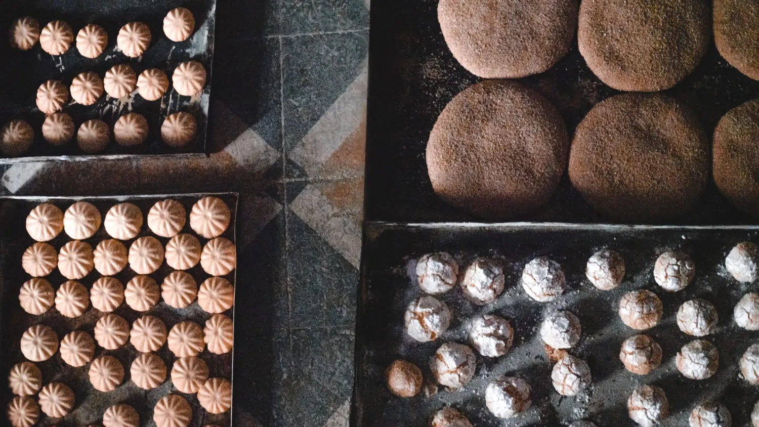 Moroccan wedding sweet table with gazelle horns and fine pastries on gold trays