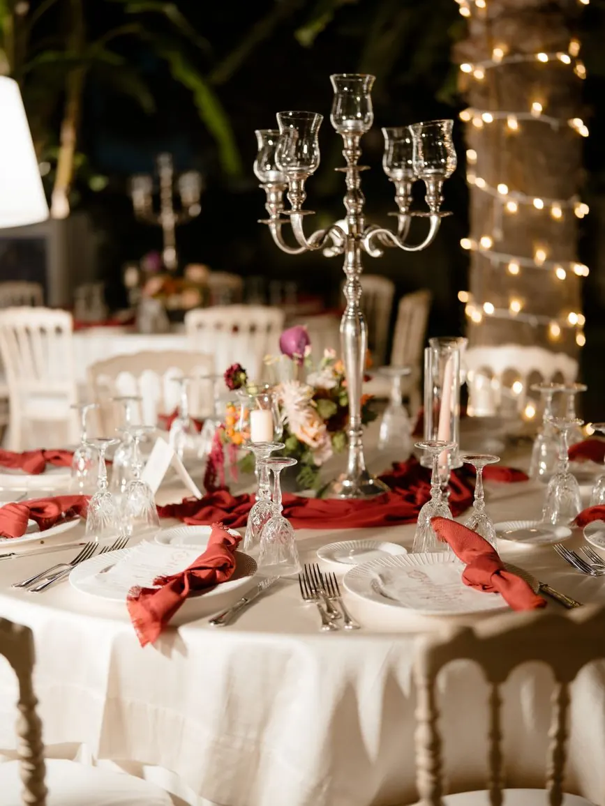 String lights above long dinner tables at an open-air Marrakech villa wedding