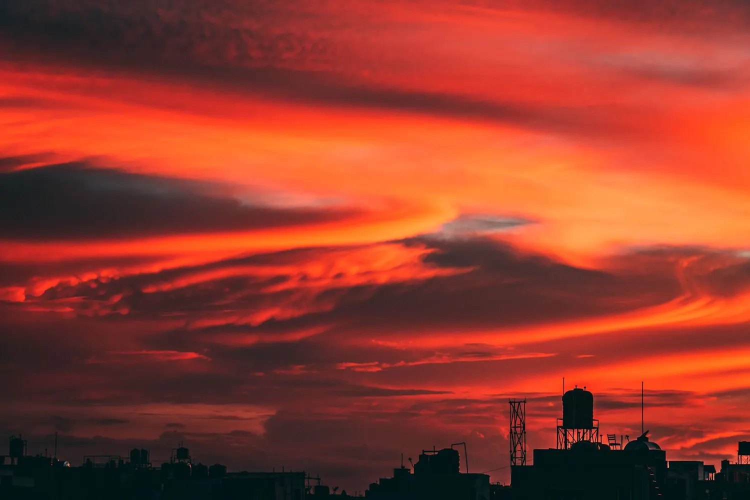 Marrakech skyline at dusk with the Koutoubia minaret in silhouette